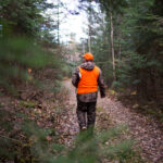 Hunter walking in the forest