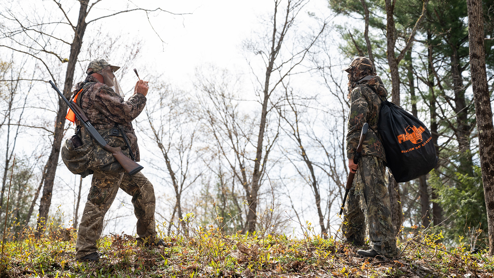 Turkey hunters using their turkey call while hunting