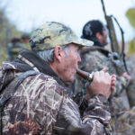 Waterfowl hunter calling during a hunt