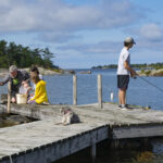 Family fishing on the docks